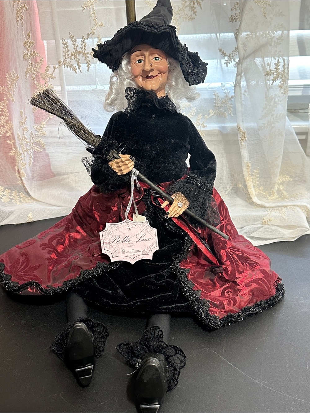 Bella Luxx Halloween sitting witch with maroon and black decor